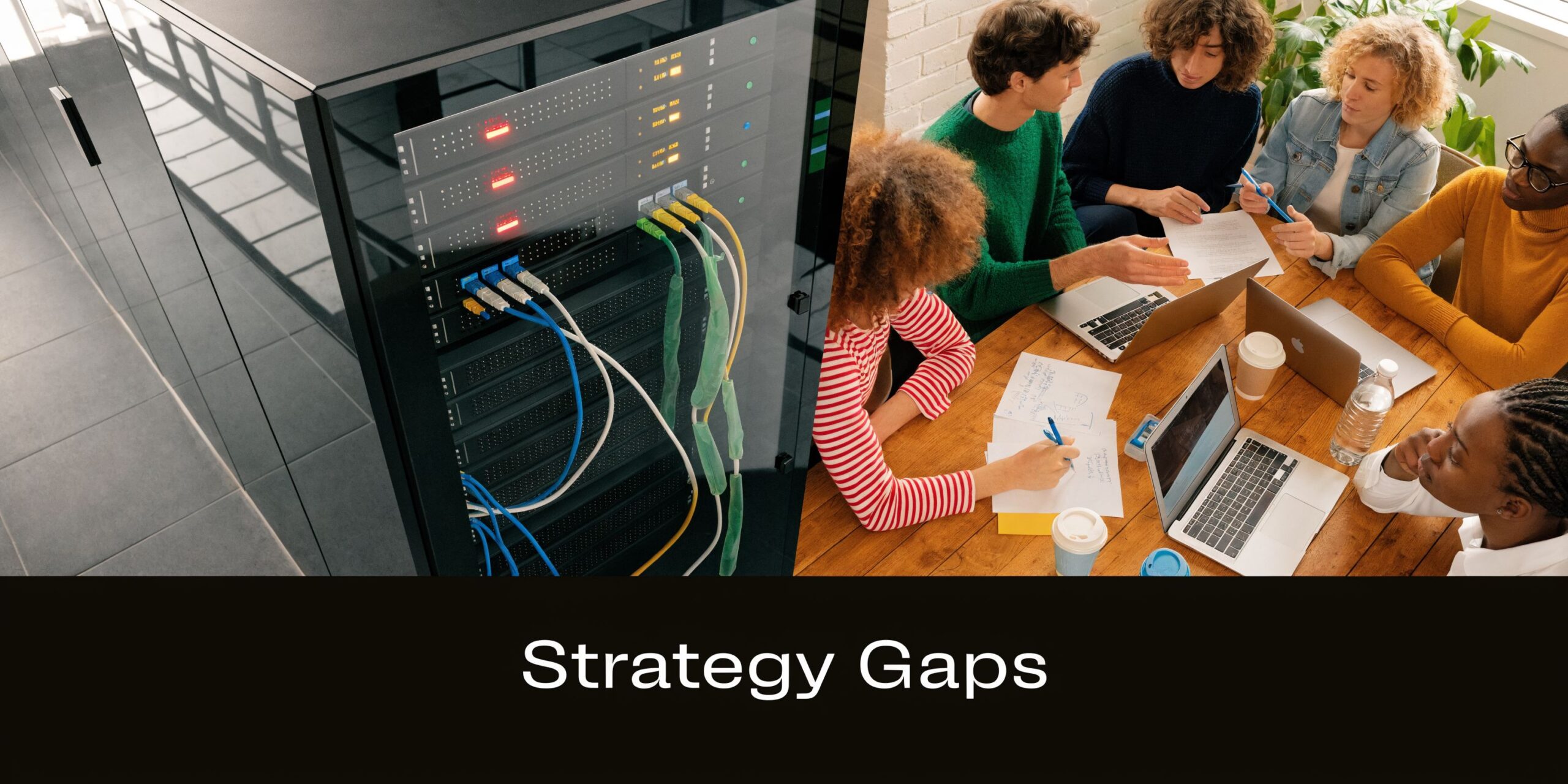 A diverse group of professionals collaborating around a table next to a large server rack in an office.